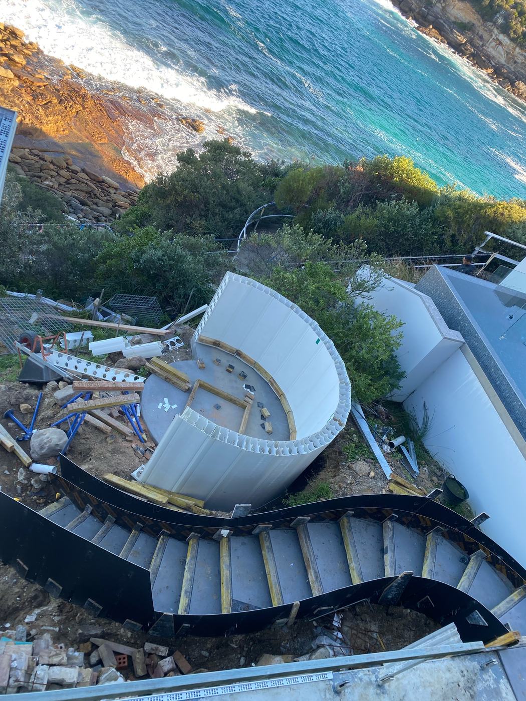 Curved seat and stairs, formed above the ocean